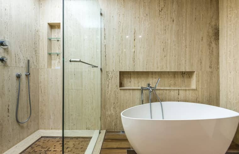 Level 1: a travertine bathroom with a freestanding tub.