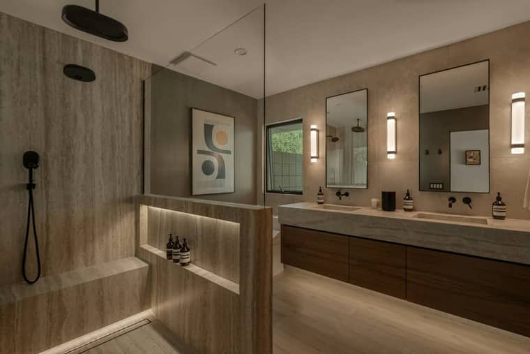 Residence 5: a travertine bathroom with a timber vanity.
